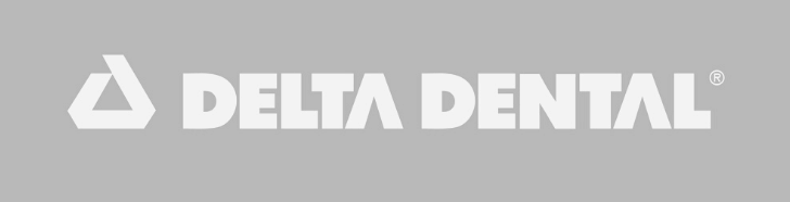 A gray background with the words delta dental in white.